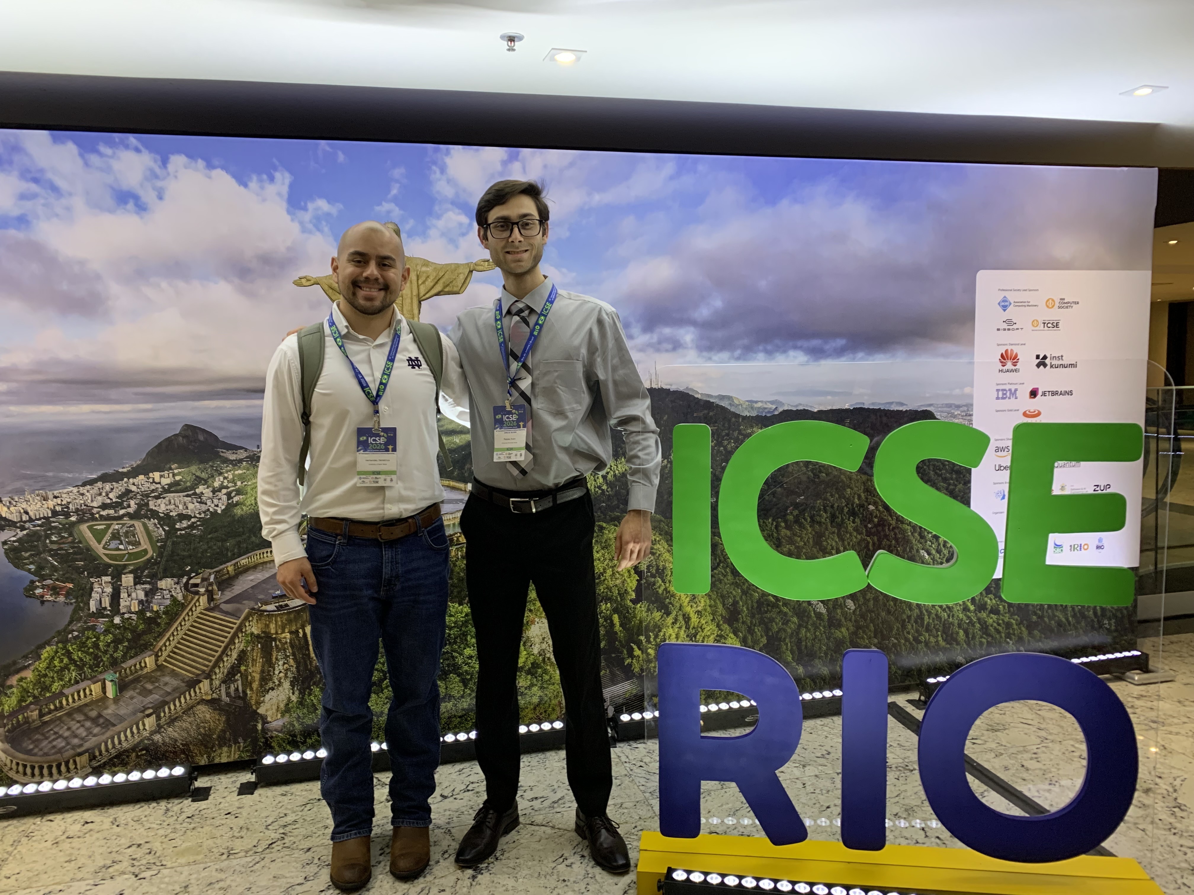 Demetrius Hernandez and I in front of the ICSE 2026 sign.